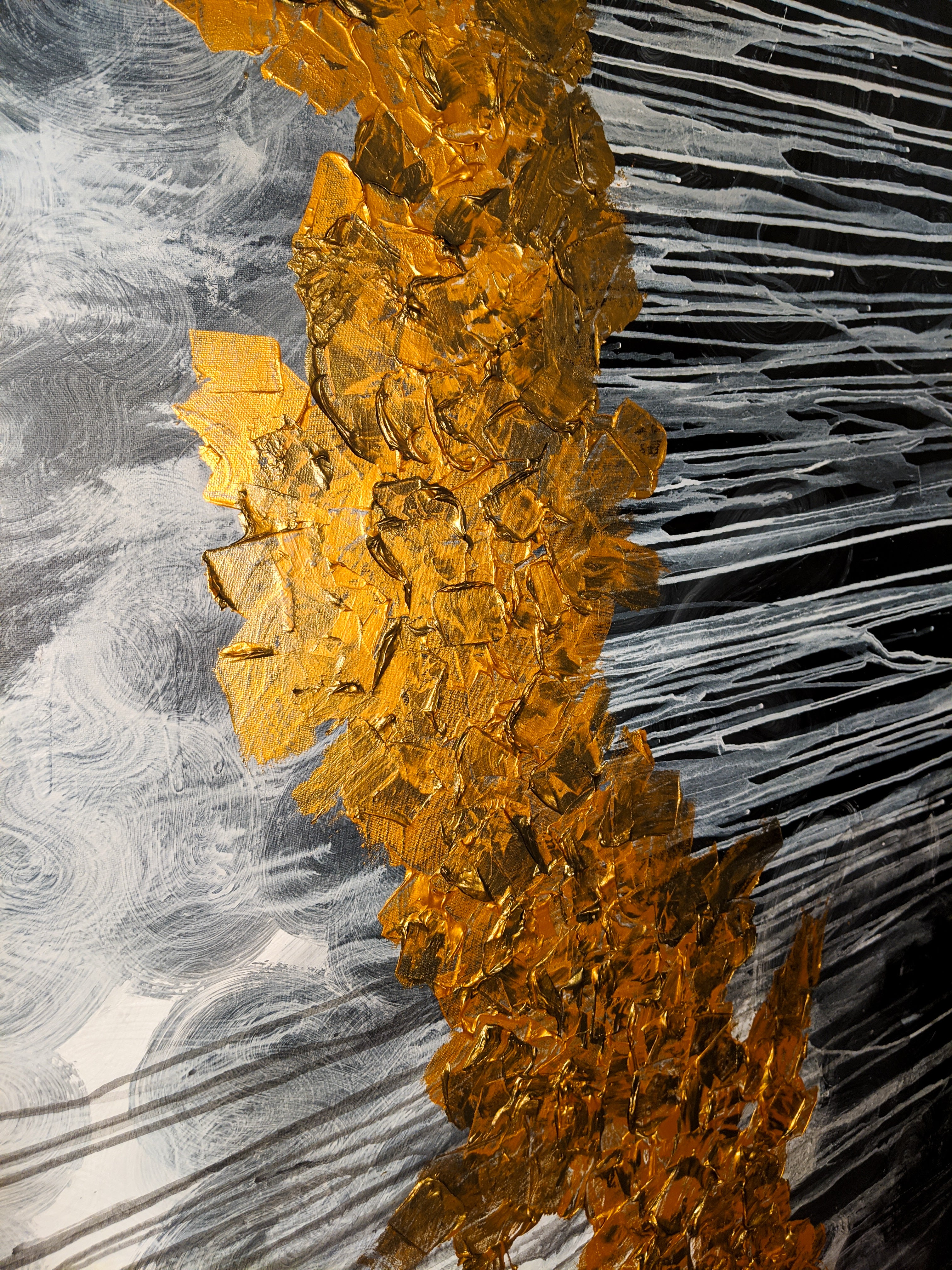 a close-up of the golden storm painting by charming cavatica. A black/grey dripping background with a textured golden messy line down the middle